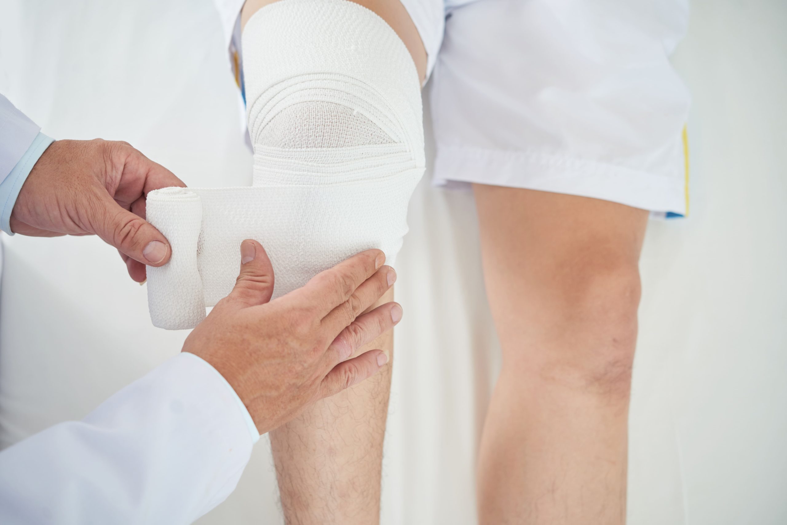 Image bandaging knee with medical wrap in clinic 2026 01 07 07 06 37 utc (1)